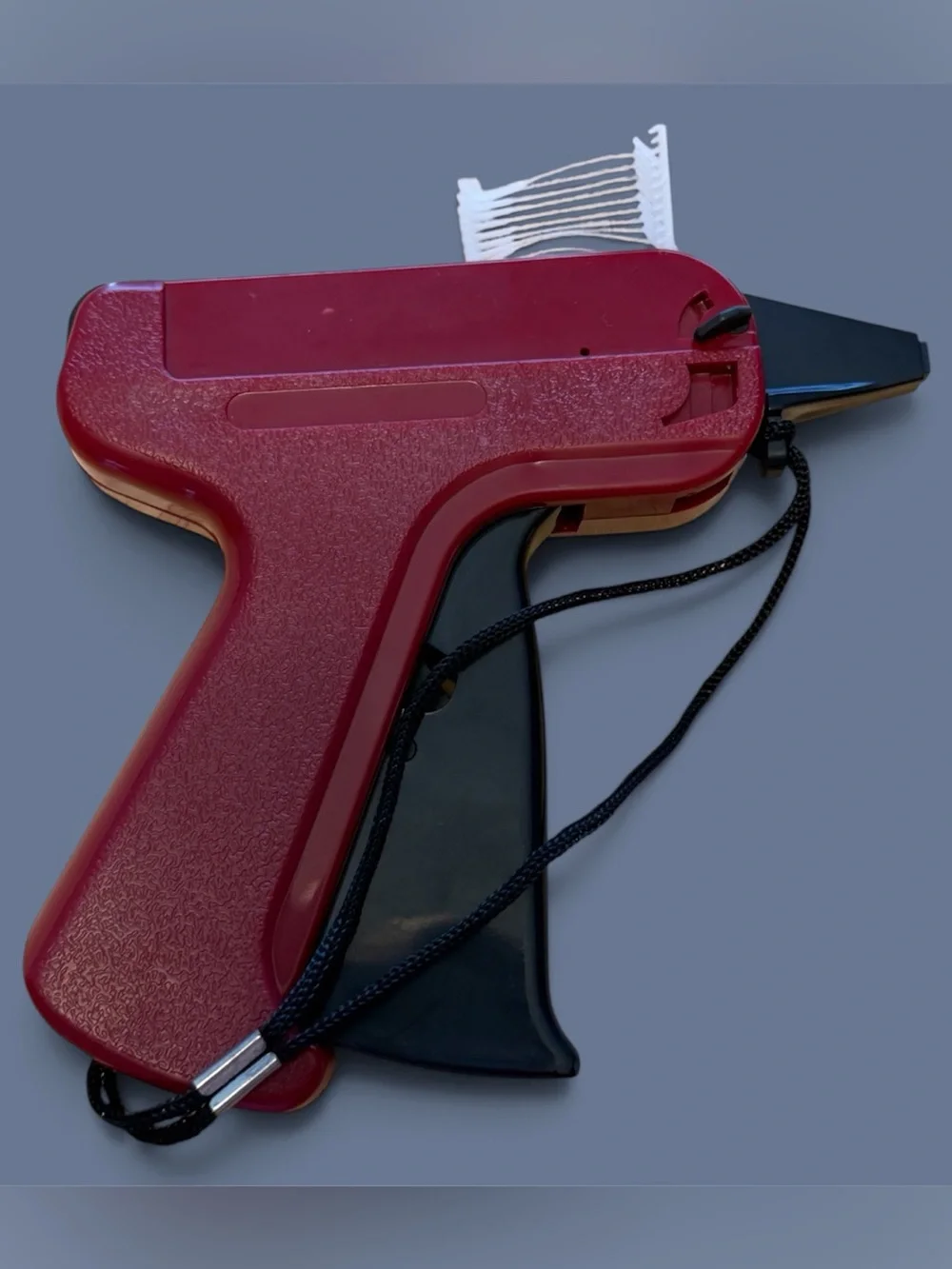 Burgundy Tagging Gun with Black Handle for Easy Price Labeling